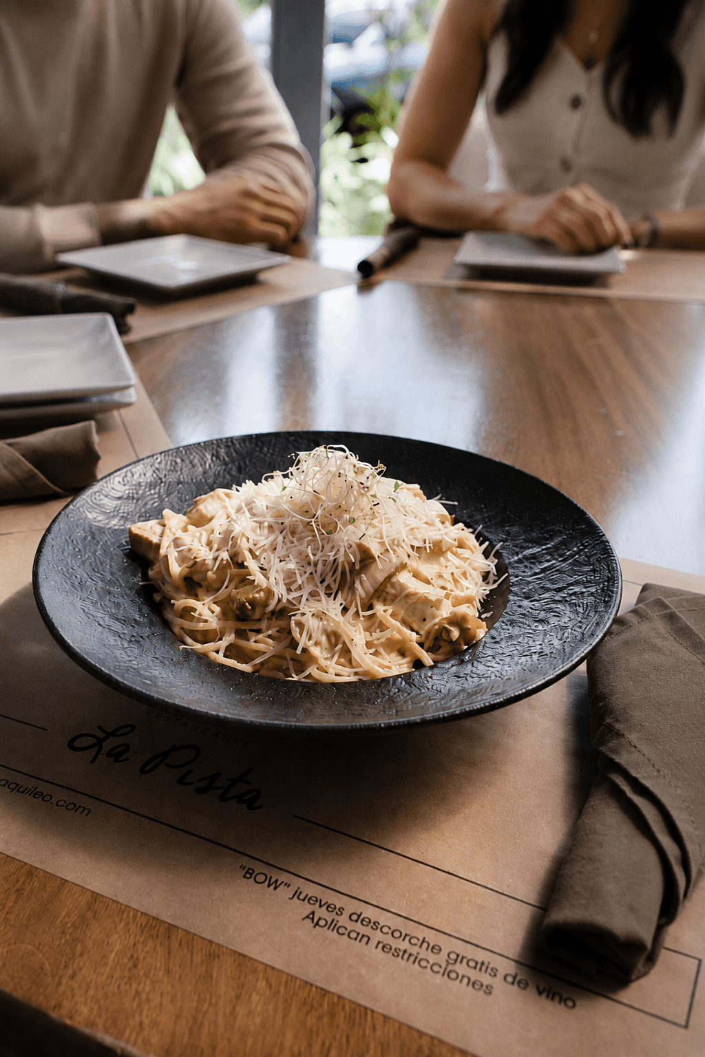 Friends gathered around a table at La Pista
